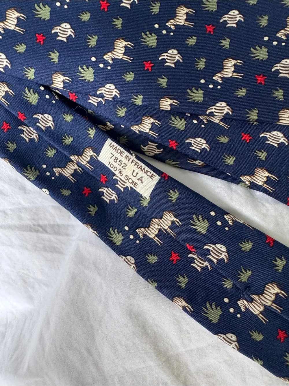 Hermès, navy silk necktie with fish and zebras and starfish MINT